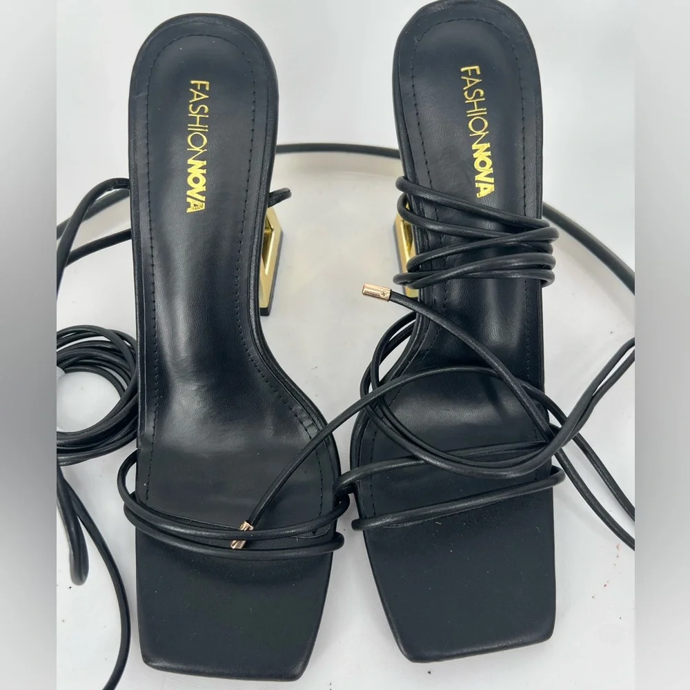 FASHION NOVA STAY WINNING WRAP UP HEELS ‎ IN BLACK GOLD NOVELTY HEELS